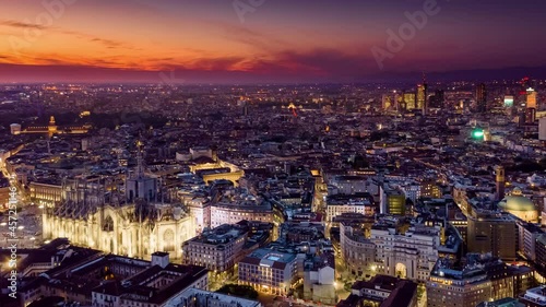 Milan Cathedral Hyperlapse Time lapse sunset. Duomo di Milano  Aerial Drone Flight Timelapse Of Panoramic Skyline Milano City life. People walking on Square during the fashion week. Drone lapse 4k photo