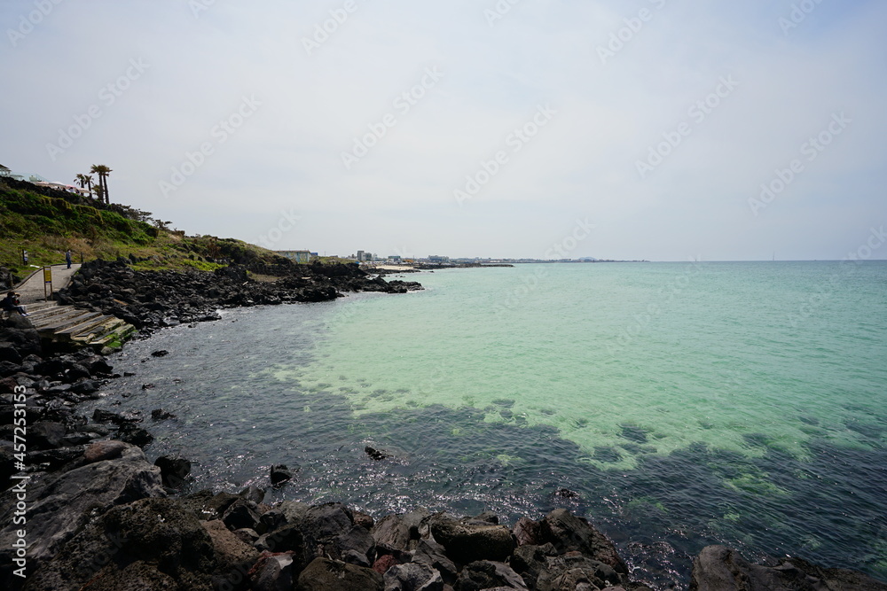 a beautiful seaside landscape with clear bluish water