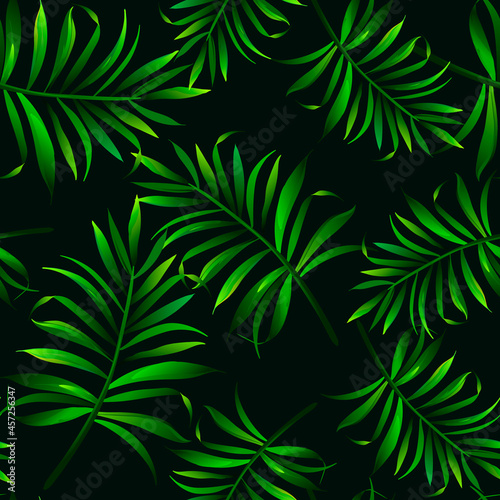 Green tropical palm leaves seamless vector pattern on the black background.Trendy summer print.