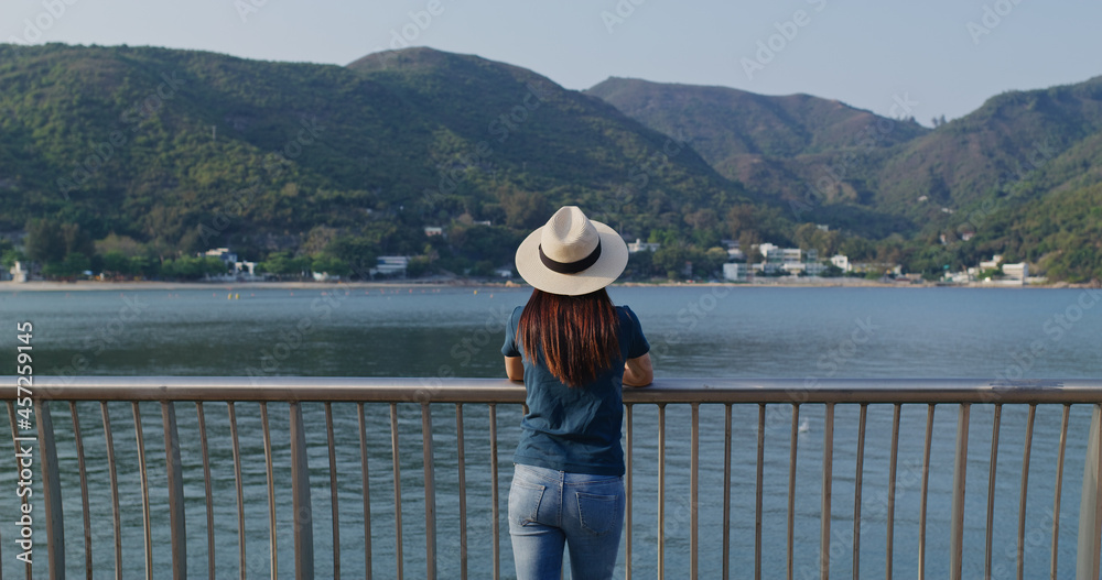 Woman enjoy the landscape sea view Woman enjoy the landscape sea view