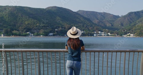Woman enjoy the landscape sea view © leungchopan
