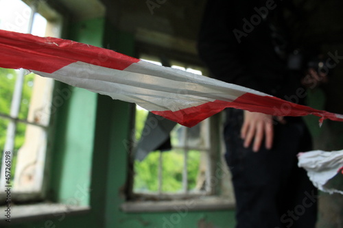 A red and white barrier tape
