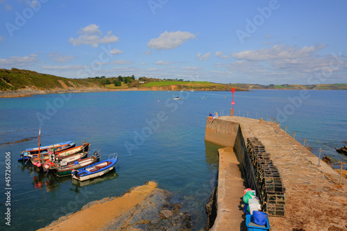 Portscatho Cornwall Roseland Peninsula harbour wall with boats Cornish coast of England UK photo