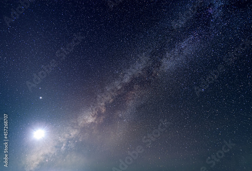 the milky way with bright moon light in stary night