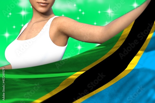 pretty girl holds Tanzania flag in front on the teal, sea-green colorful clouds - flag concept 3d illustration