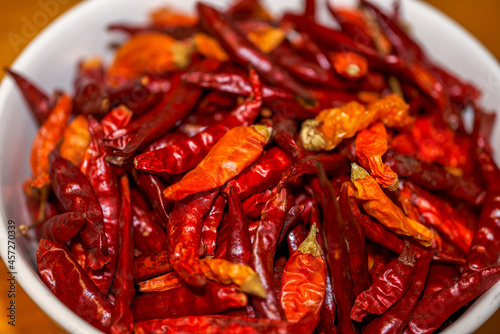 A bowl of bright red dried chili close-up
