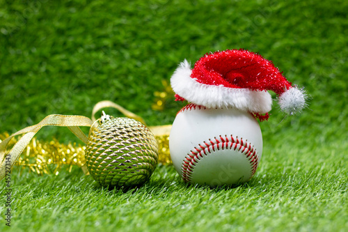 Baseball with Christmas Decoration are on green grass