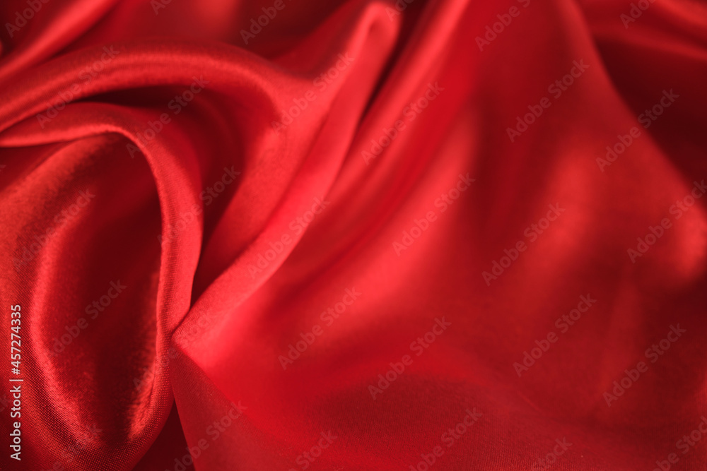 Obraz premium abstract texture of draped red velvet background. eautiful textile backdrop. Close-up. Top view
