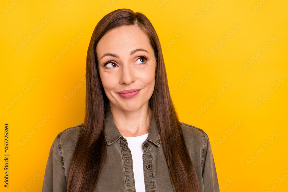 Photo of dream happy young woman look empty space news sale imagine isolated on yellow color background Photo of dream happy young woman look empty space news sale imagine isolated on yellow color background