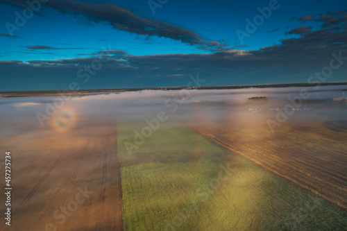 Fogbow over the fields, aerial picture of rare optic phenomena