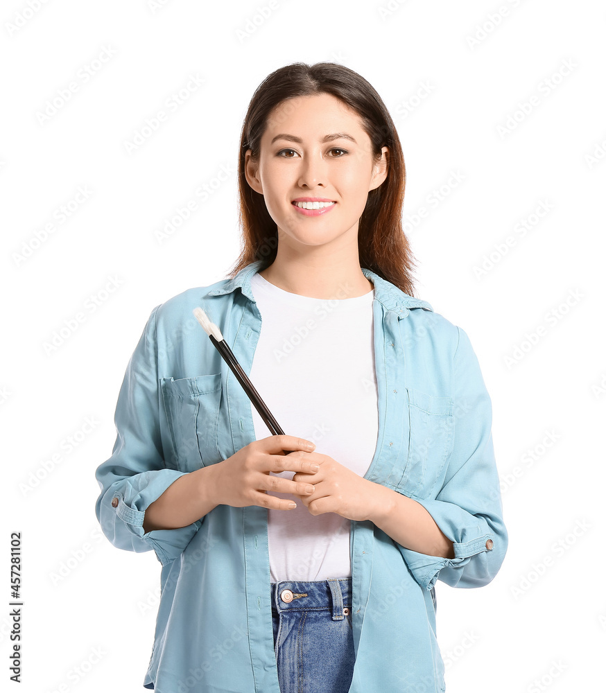 Female Asian calligraphist on white background Female Asian calligraphist on white background