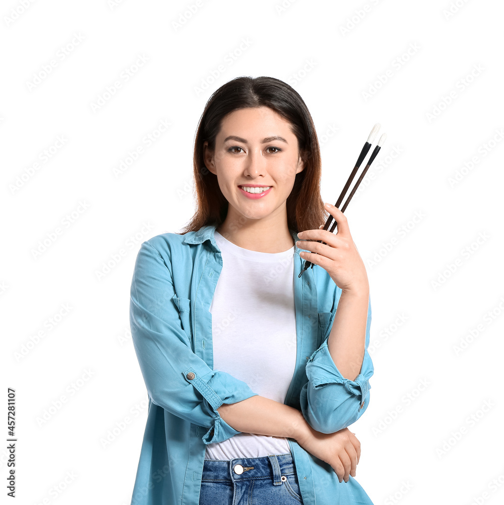 Female Asian calligraphist on white background Female Asian calligraphist on white background