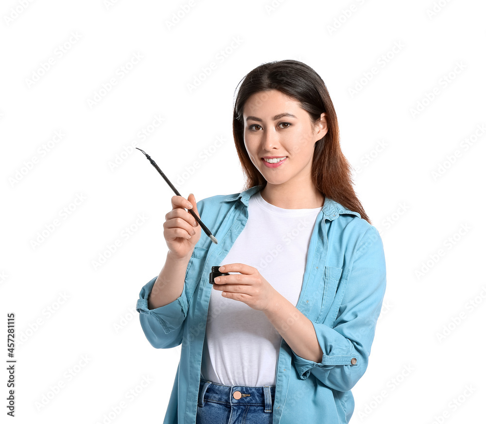 Female Asian calligraphist on white background Female Asian calligraphist on white background