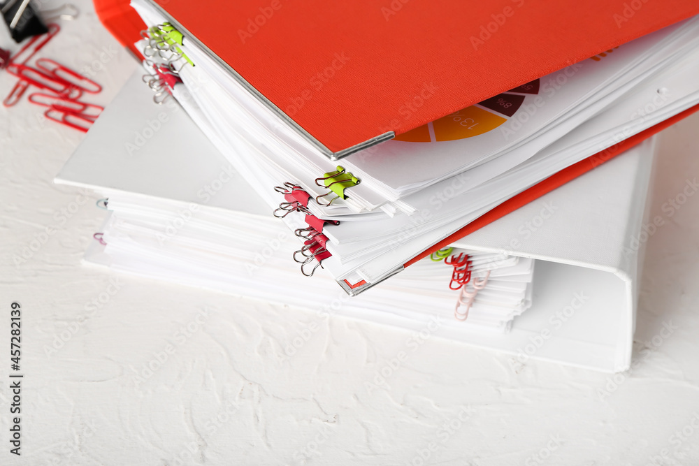 Fototapeta premium Stack of folders with documents on table
