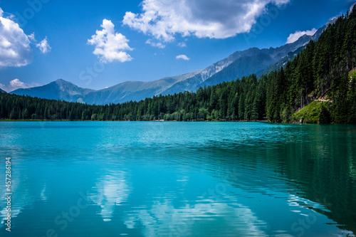 Turquoise mountain lake with blue sky