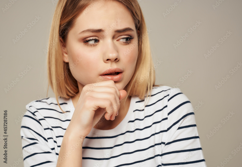pretty woman in striped t-shirt frustration emotion displeasure pretty woman in striped t-shirt frustration emotion displeasure