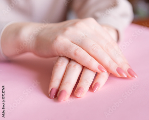 Beautiful female hands. Application Cream  Lotion. Spa and manicure concept. Soft skin  skin care concept.