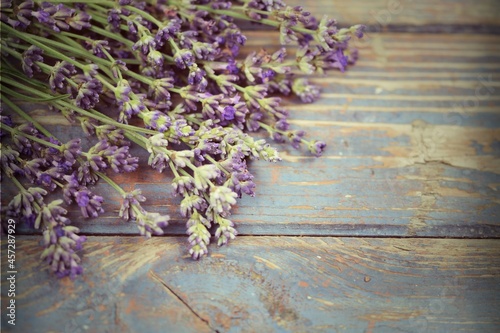 Fototapeta Naklejka Na Ścianę i Meble -  Lavender on wooden background, vintage rustic lavender image with empty space for text.