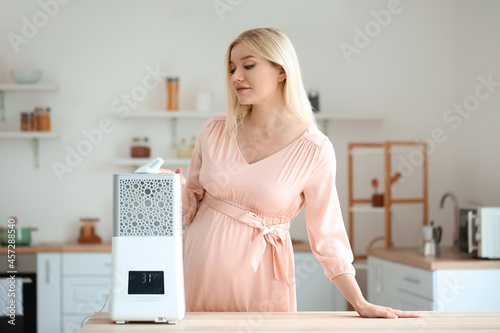 Pregnant woman with modern ...