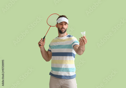 Sporty male badminton playe...