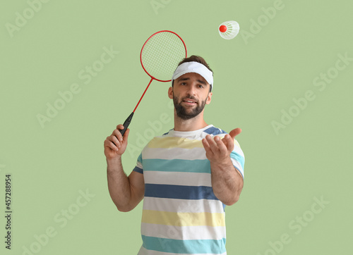 Sporty male badminton playe...