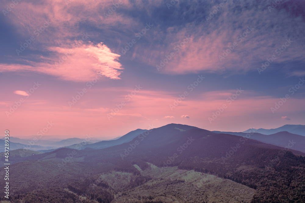 Obraz premium Mountain view against the background of the sunset sky in summer