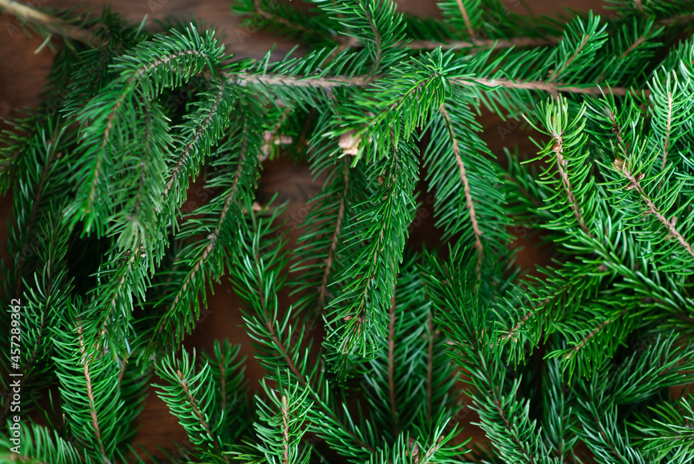 Background of green fir branches for Christmas New Year celebration greeting card design