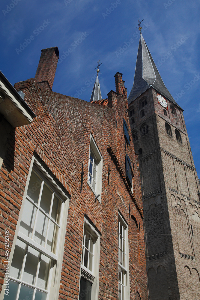 The Saint Nicholas Church in Deventer, the Netherlands, against a blue sky with fluffy clouds
