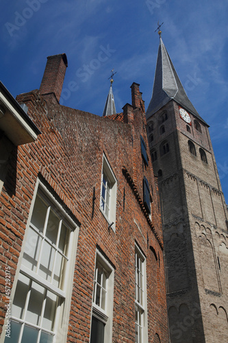 The Saint Nicholas Church in Deventer, the Netherlands, against a blue sky with fluffy clouds