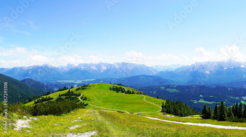 Wank mountain peaks near Garmisch-Partenkirchen, Bavaria. View from above of the surrounding landscape with mountains. © Elly Miller