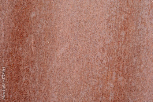 Rust on painted metal when exposed to the environment.