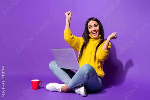 Full body photo of astonished cheerful person fists up open mouth isolated on violet color background © deagreez