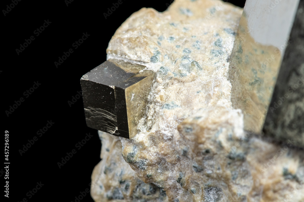 Macro Pyrite mineral stone on black background Macro Pyrite mineral stone on black background