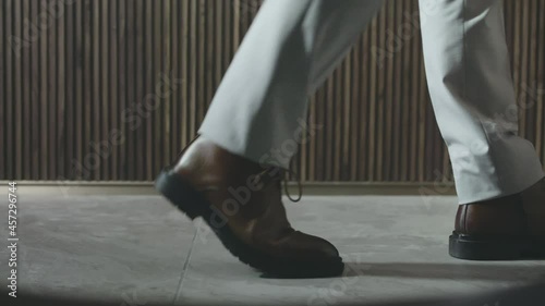 closeup of businessman feet walking inside office