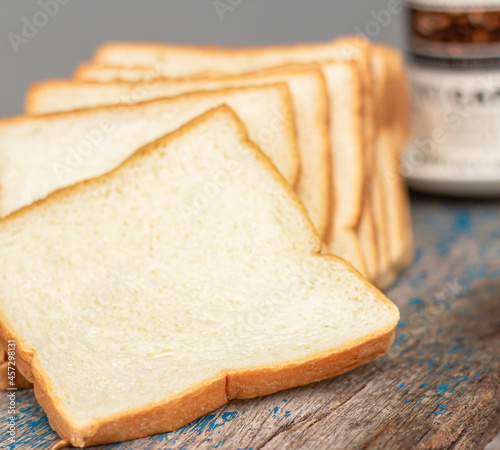 Image selected focus at close-up pile heap on stacked bread a slice of the bakery is food breakfast bake sliced on blur background.