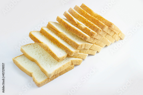 Image isolated close-up pile heap on stacked bread a slice of the bakery is food breakfast bake sliced on white background.
