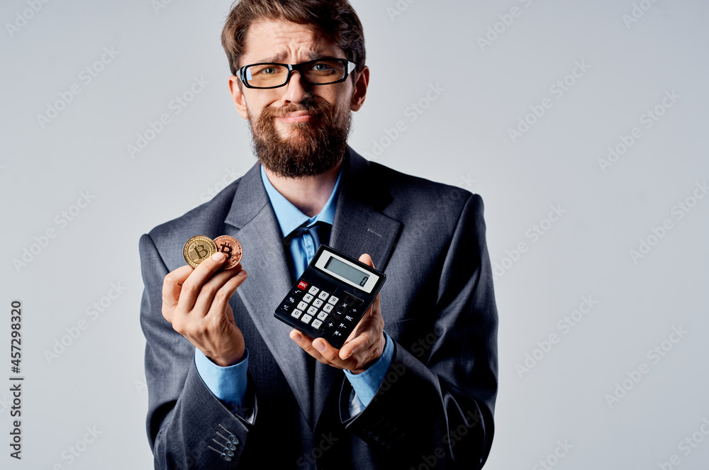 emotional man calculator bitcoin in hand counting finance studio official emotional man calculator bitcoin in hand counting finance studio official