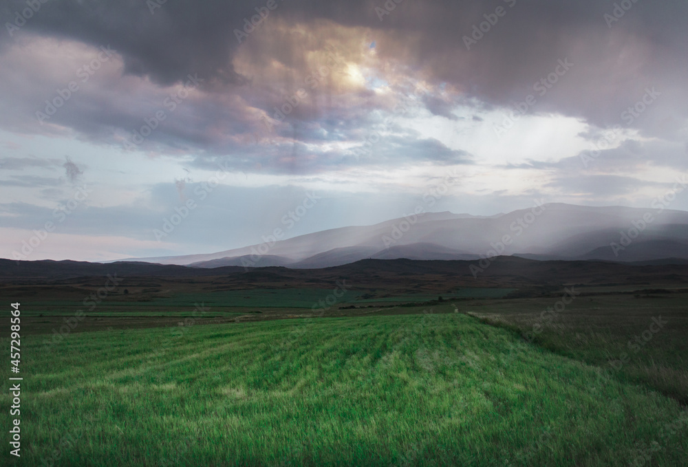 Fototapeta premium Clouds over the mountains. Landscape After Rain