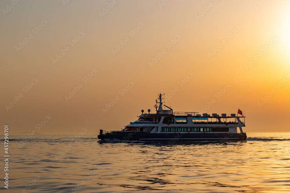 Ferry boat in Marmara sea near Istanbul coast. Sunset time