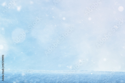 snow layer on the sky background with flying snowflakes © VeKoAn