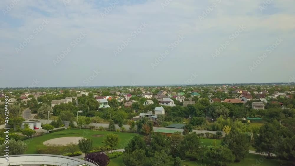 Aerial view of countryside with residential buildings in summer day Aerial view of countryside with residential buildings in summer day