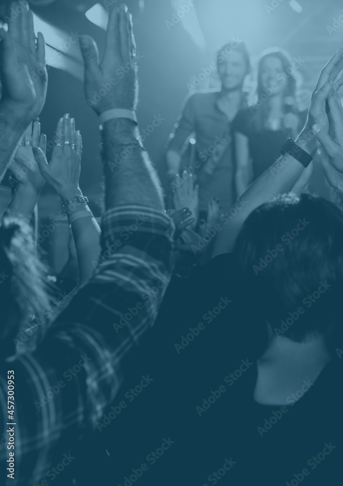 Blue overlay over group of people enjoying at a music concert