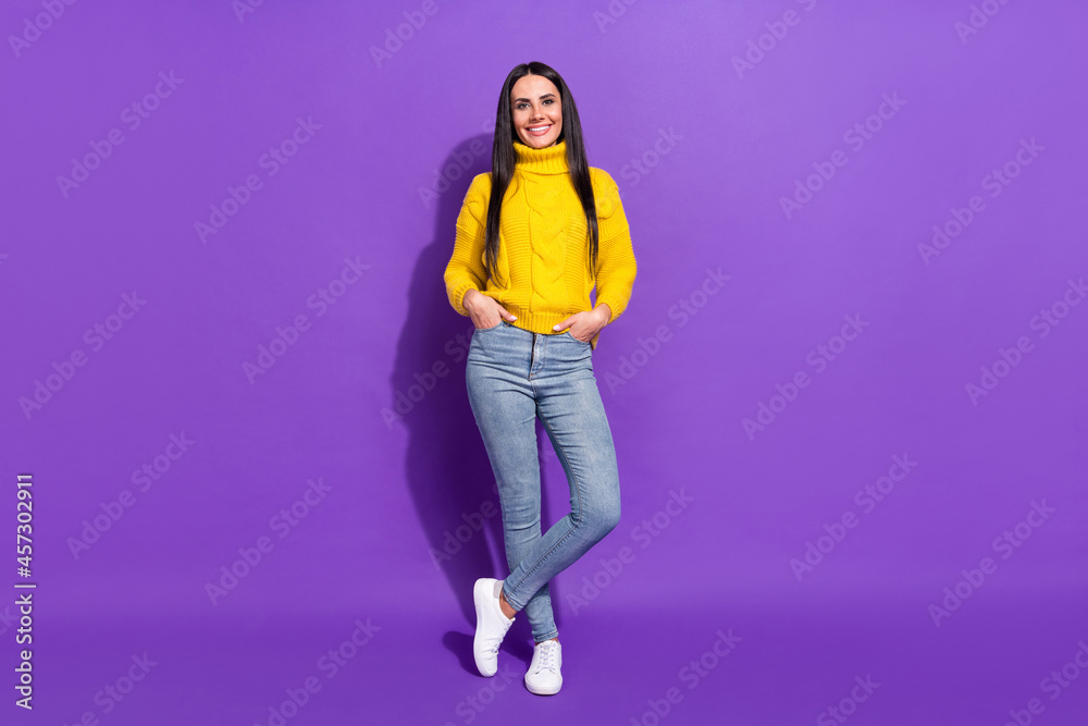 Full length photo of gorgeous satisfied person put hands in pockets toothy smile isolated on violet color background Full length photo of gorgeous satisfied person put hands in pockets toothy smile isolated on violet color background
