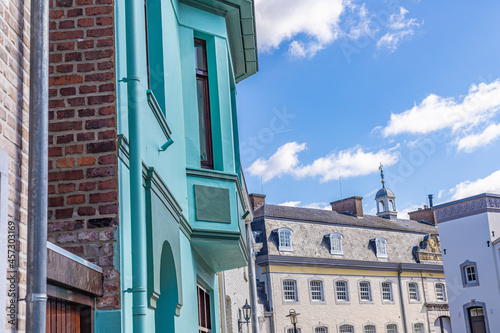 Beautiful shot of buildings and rooftops in Vaals, Netherlands, under cloudy blue sky photo