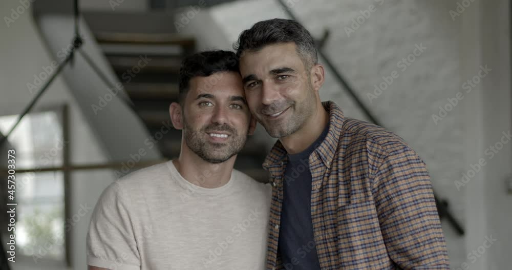 Portrait of hispanic gay couple in love at home Portrait of hispanic gay couple in love at home