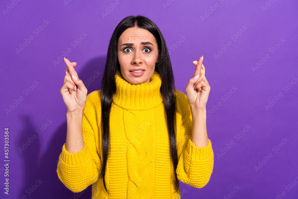 Photo of pretty panicking lady staring camera crossed two hands fingers isolated on violet color background Photo of pretty panicking lady staring camera crossed two hands fingers isolated on violet color background