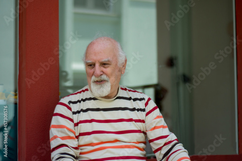 Retired old man smoking and coughing. an unhealthy life. Selective Focus 