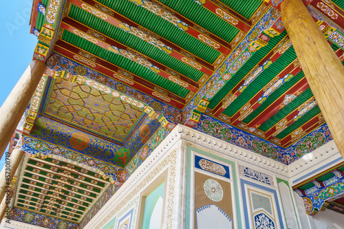 Traditional oriental patterns of ceiling and walls of street gallery of Hazrat Khizr mosque in Samarkand, Uzbekistan photo