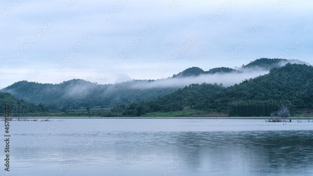 Fog in the early morning on a mountain lake Early morning.