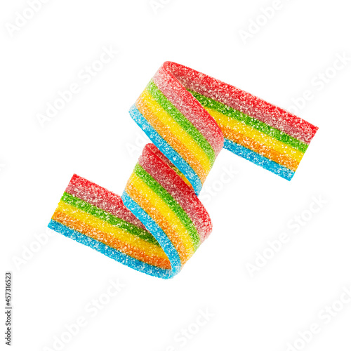 Rainbow sour jelly candy strip in sugar sprinkles isolated over white background